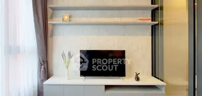 Modern living room with sleek TV stand and decorative shelves