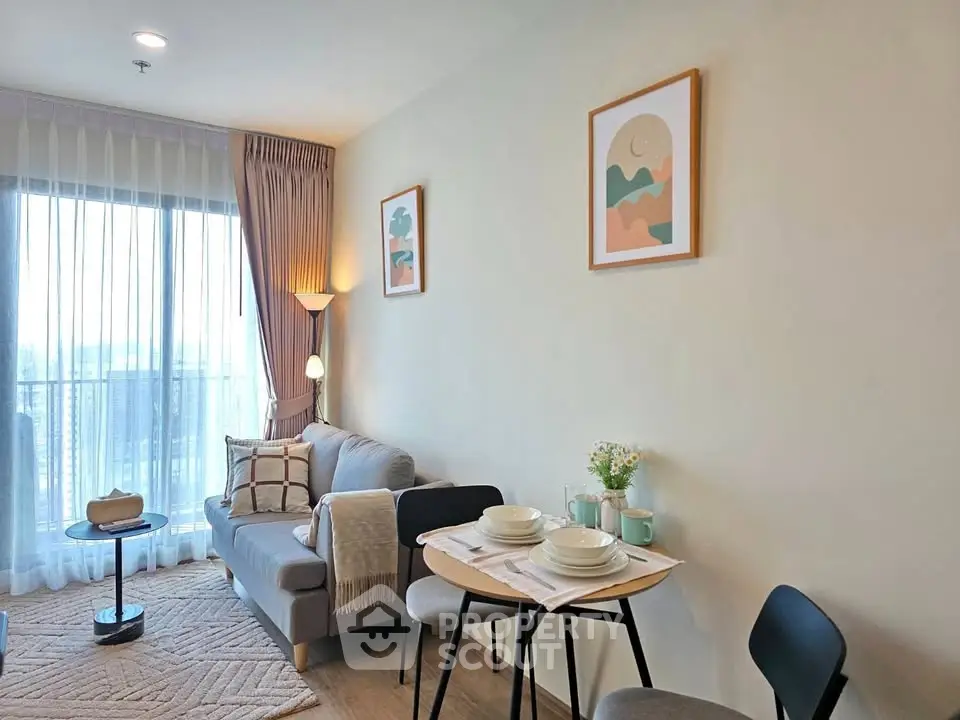 Modern living room with cozy decor and city view, perfect for urban living.