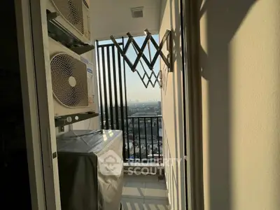 Compact balcony with city view and air conditioning units, ideal for urban living.