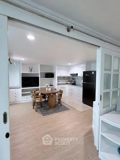 Spacious open-layout kitchen with dining area and modern appliances