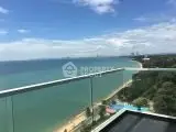 Stunning ocean view from high-rise balcony overlooking the coastline and city skyline.
