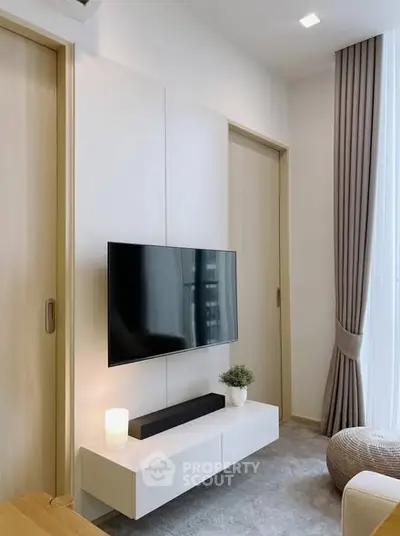 Modern living room with wall-mounted TV and elegant decor