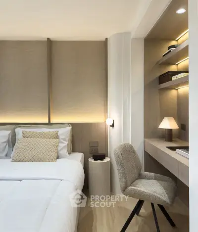 Modern bedroom with cozy study nook and elegant lighting