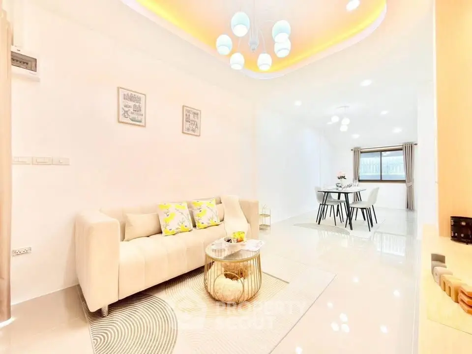 Modern living room with elegant lighting and open dining area