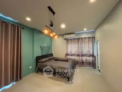 Spacious modern bedroom with stylish lighting and elegant curtains