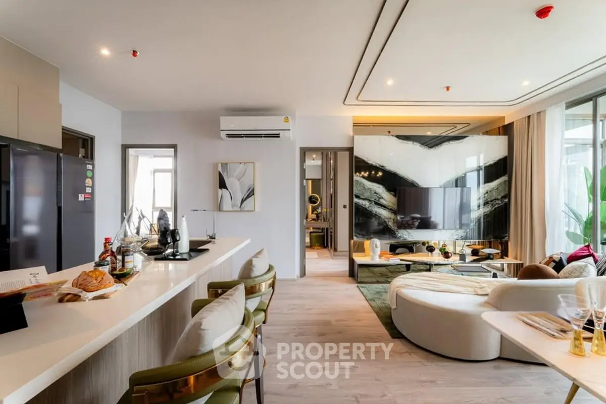 Luxurious open-plan living room with modern kitchen and stylish decor