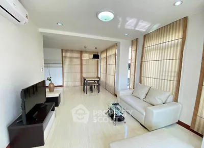 Spacious living room with modern furniture and natural light