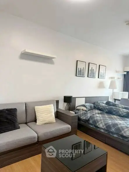 Modern studio apartment with cozy living area and stylish decor
