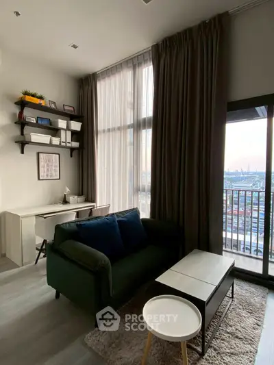Modern living room with large windows and city view, featuring stylish furniture and cozy decor.