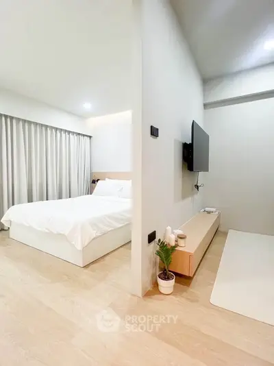 Modern minimalist bedroom with sleek design and natural light