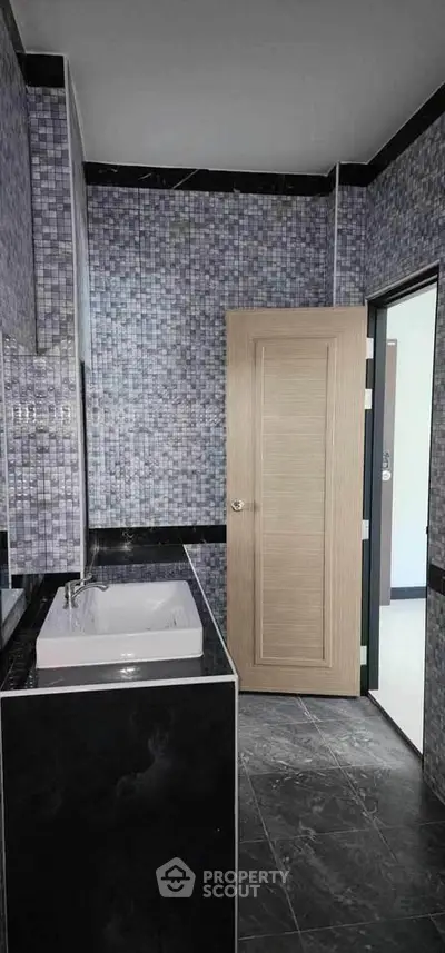 Modern bathroom with stylish tile design and sleek fixtures