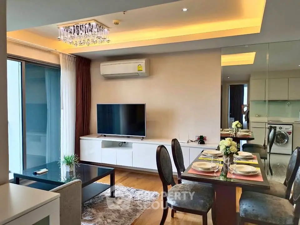 Modern living room with elegant dining area and stylish decor in a contemporary apartment.