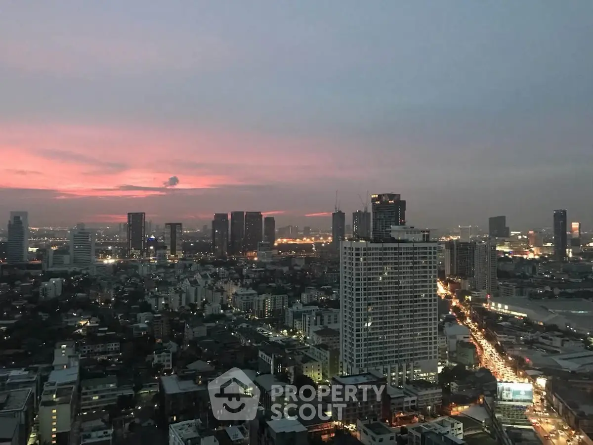 Stunning cityscape view at dusk showcasing urban skyline and vibrant city lights.