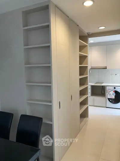 Modern kitchen with sleek cabinetry and built-in appliances