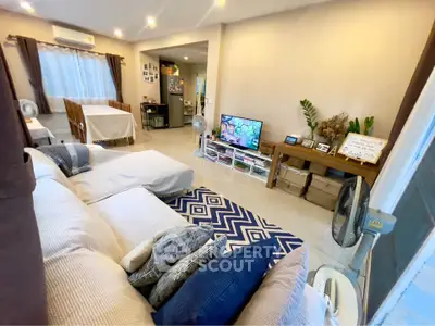 Spacious living room with modern decor and cozy seating area