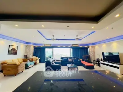 Spacious modern living room with elegant lighting and large windows