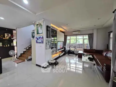 Spacious living room with modern decor and ample natural light