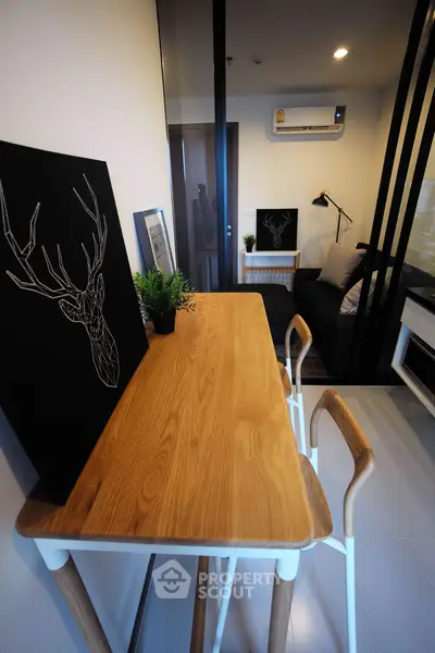 Modern apartment interior with stylish decor and wooden dining table