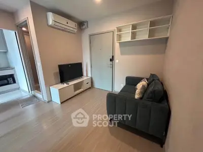 Modern living room with sleek furniture and air conditioning in a cozy apartment.