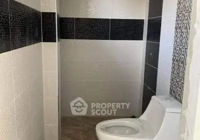 Modern bathroom with sleek black and white tile design
