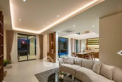 Luxurious open-plan living room with modern kitchen and elegant lighting