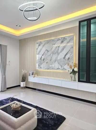 Luxurious modern living room with elegant lighting and marble accents, perfect for stylish living.