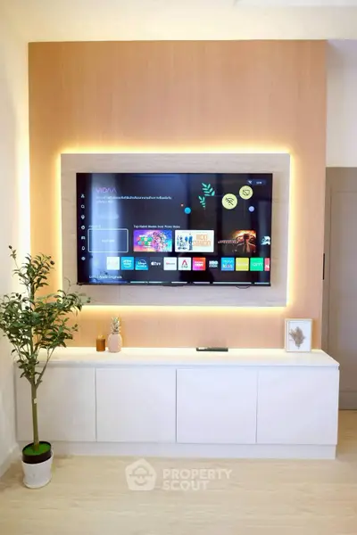 Modern living room with sleek TV setup and ambient lighting