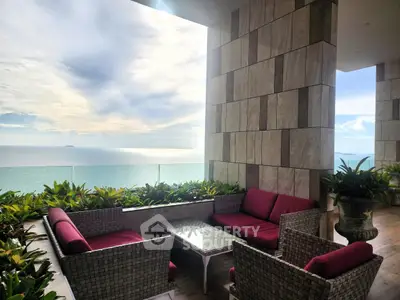 Luxurious balcony with stunning ocean view and elegant seating area
