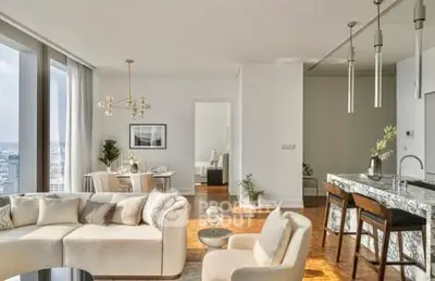 Luxurious open-plan living room with city view and modern kitchen