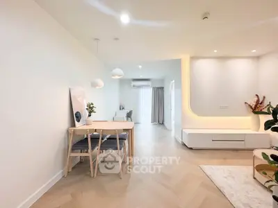 Modern living room with elegant dining area and stylish decor