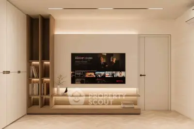 Modern living room with built-in shelves and wall-mounted TV, showcasing minimalist design.
