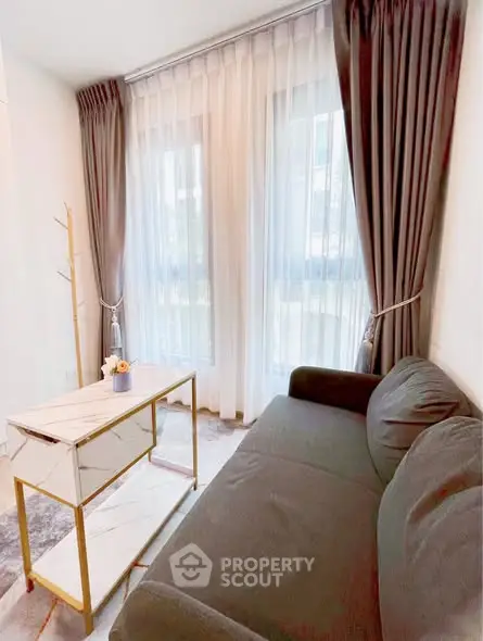 Chic living room with elegant curtains and modern sofa, perfect for cozy relaxation.