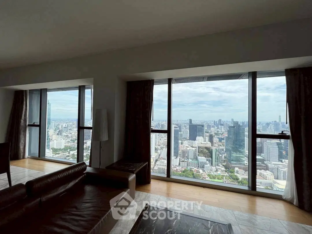 Luxurious living room with panoramic city view from high-rise windows