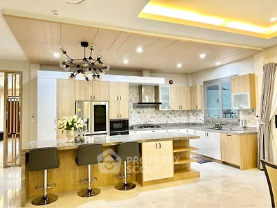 Luxurious modern kitchen with marble countertops and stylish lighting