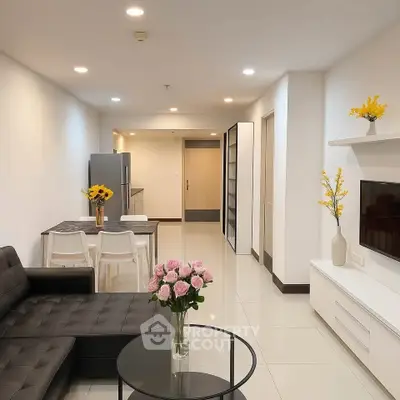 Modern living room with sleek furniture and open layout, perfect for contemporary living.