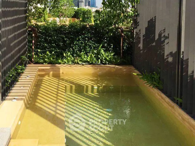 Luxurious private pool with lush greenery and city view