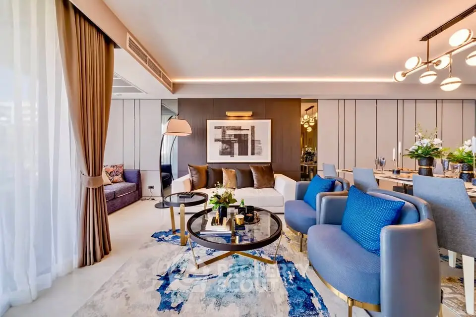 Luxurious modern living room with elegant decor and stylish furniture, featuring a spacious open layout and chic lighting.