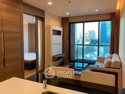 Modern living room with city view and cozy furnishings in a high-rise apartment