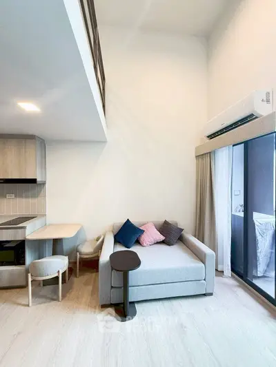 Modern loft apartment with cozy living area and stylish kitchen