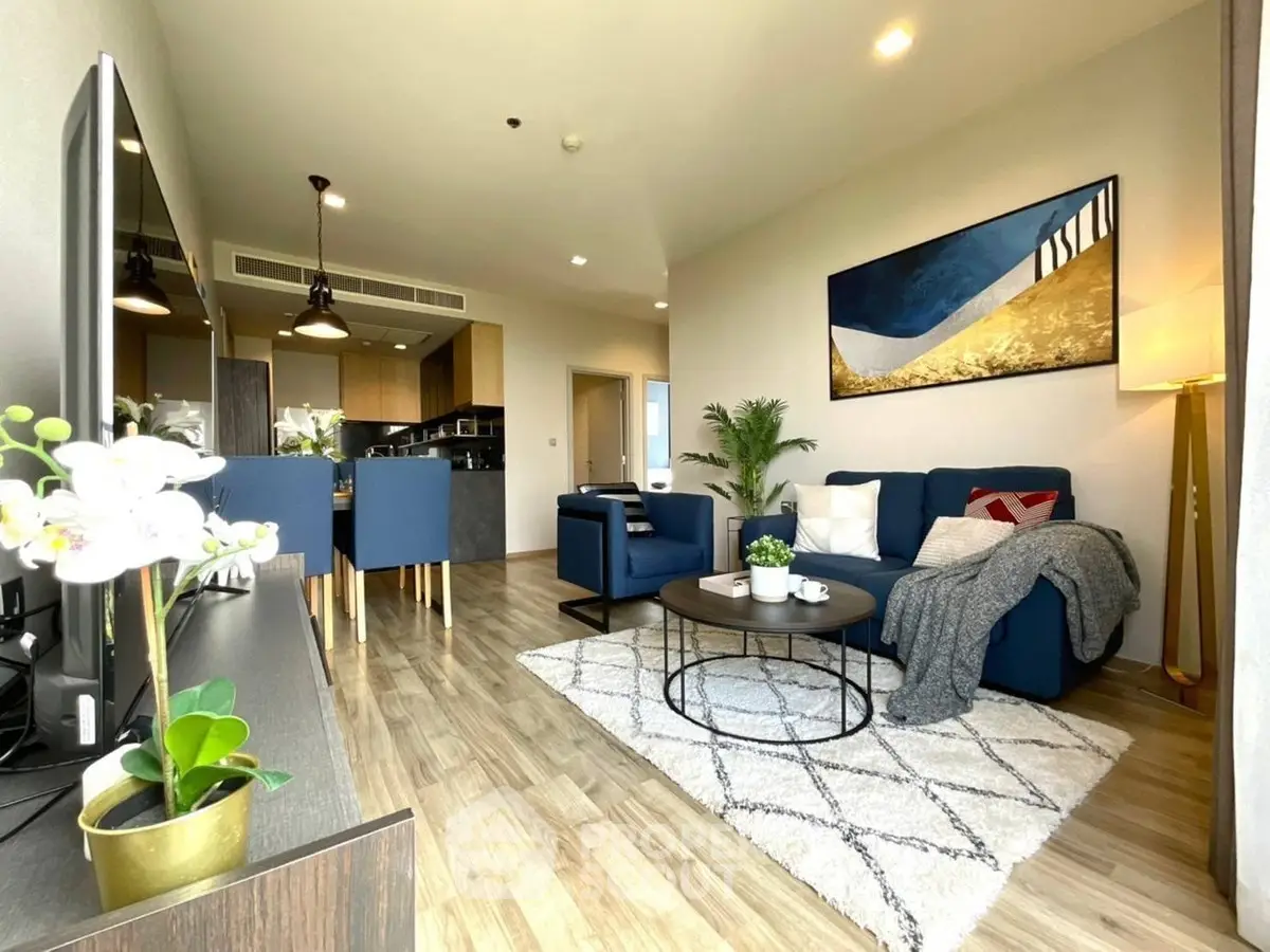 Modern living room with stylish decor and open kitchen layout