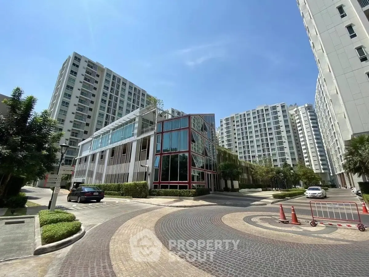 Modern residential complex with high-rise buildings and landscaped surroundings