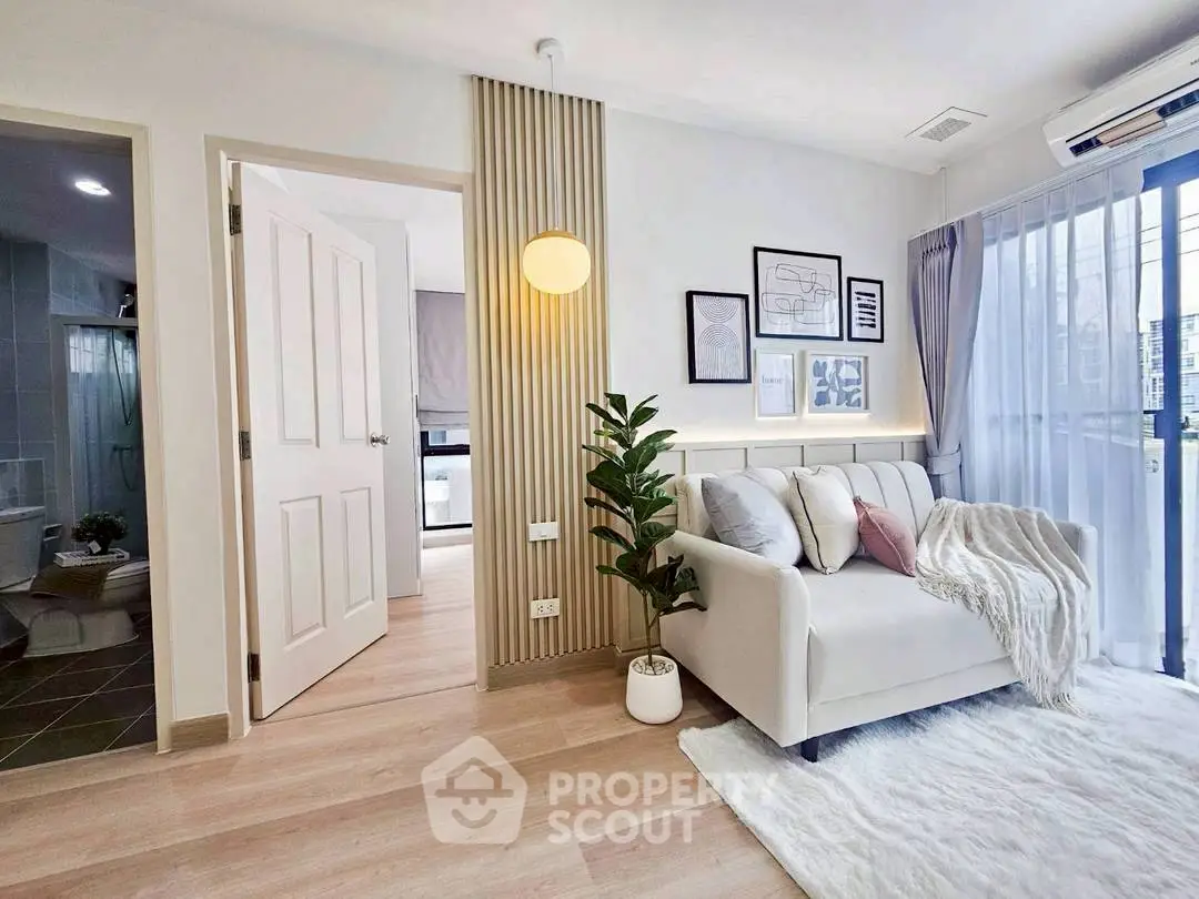 Modern living room with cozy sofa, stylish decor, and natural light