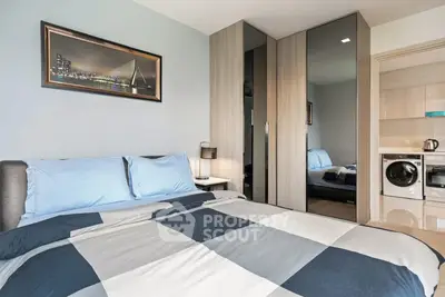 Modern bedroom with stylish decor and in-room laundry facilities