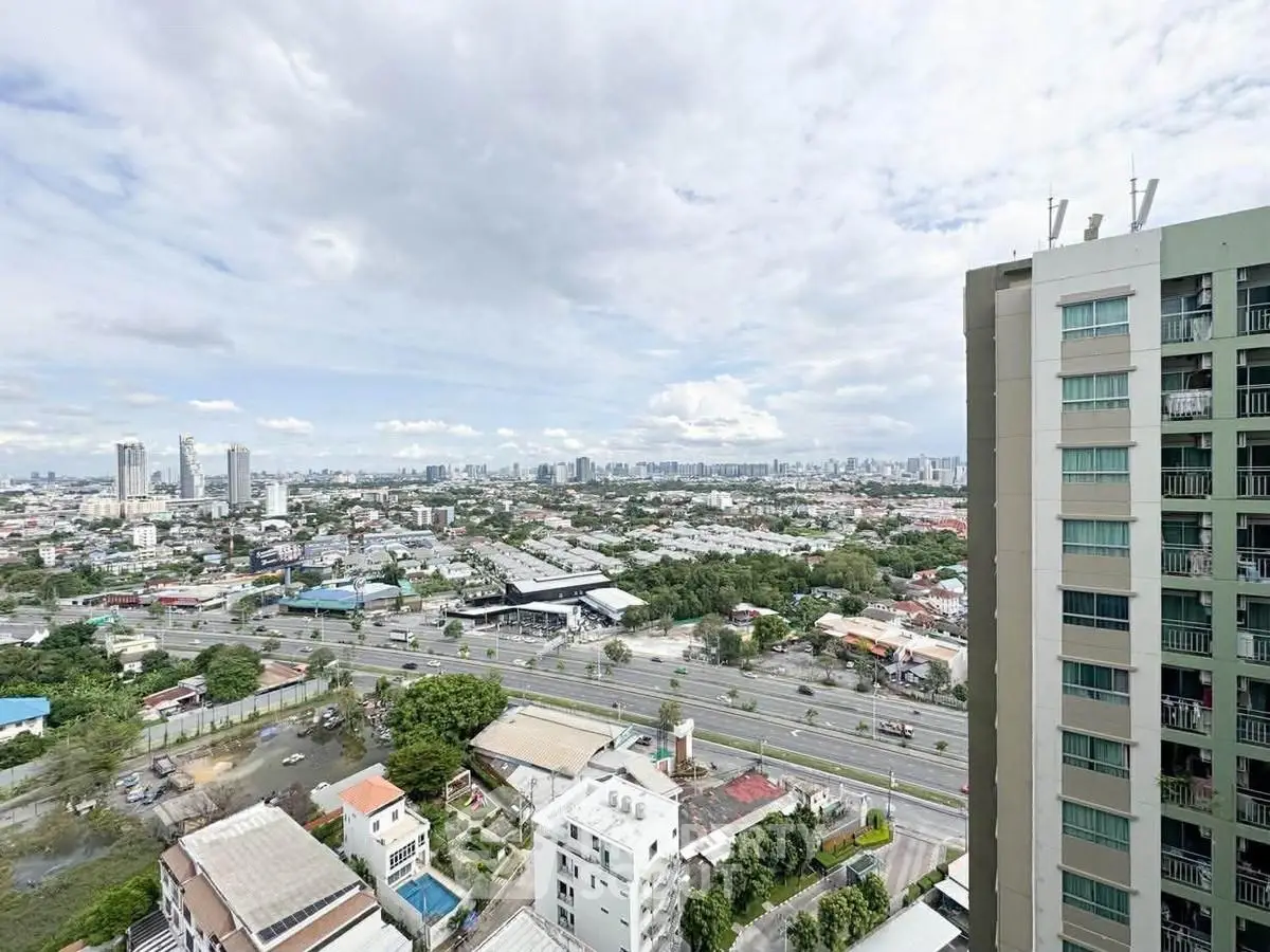 Stunning cityscape view from high-rise building balcony, showcasing urban skyline and expansive horizon.
