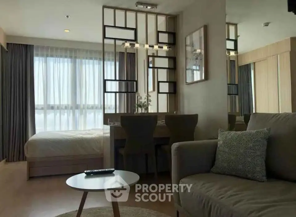 Modern studio apartment with cozy living area and stylish decor
