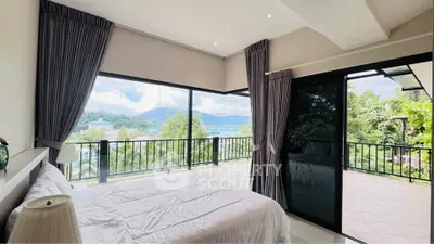 Luxurious bedroom with stunning panoramic view and spacious balcony access