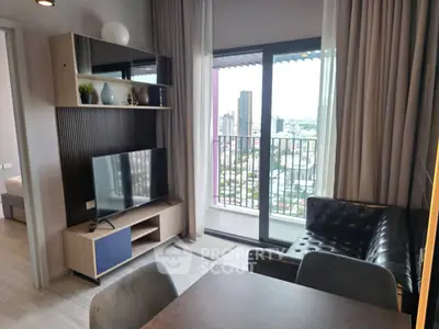 Modern living room with city view and stylish furniture in high-rise apartment