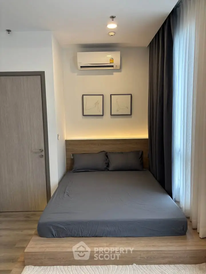 Modern bedroom with sleek design, featuring a cozy bed, stylish decor, and ambient lighting.