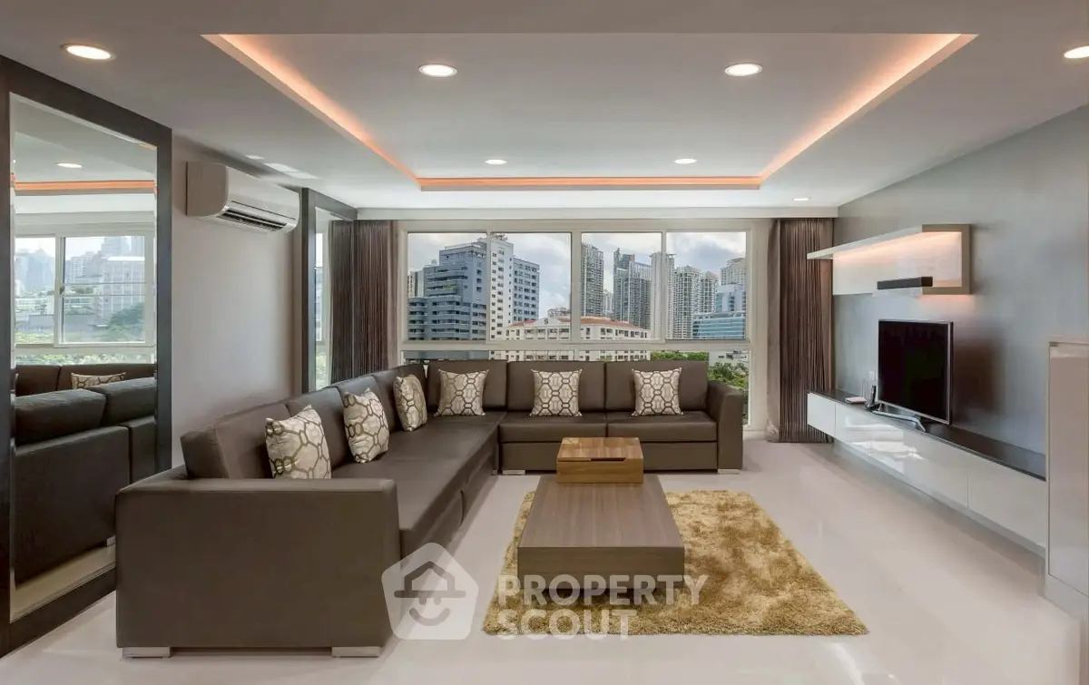 Luxurious modern living room with city view, elegant decor, and spacious seating area.