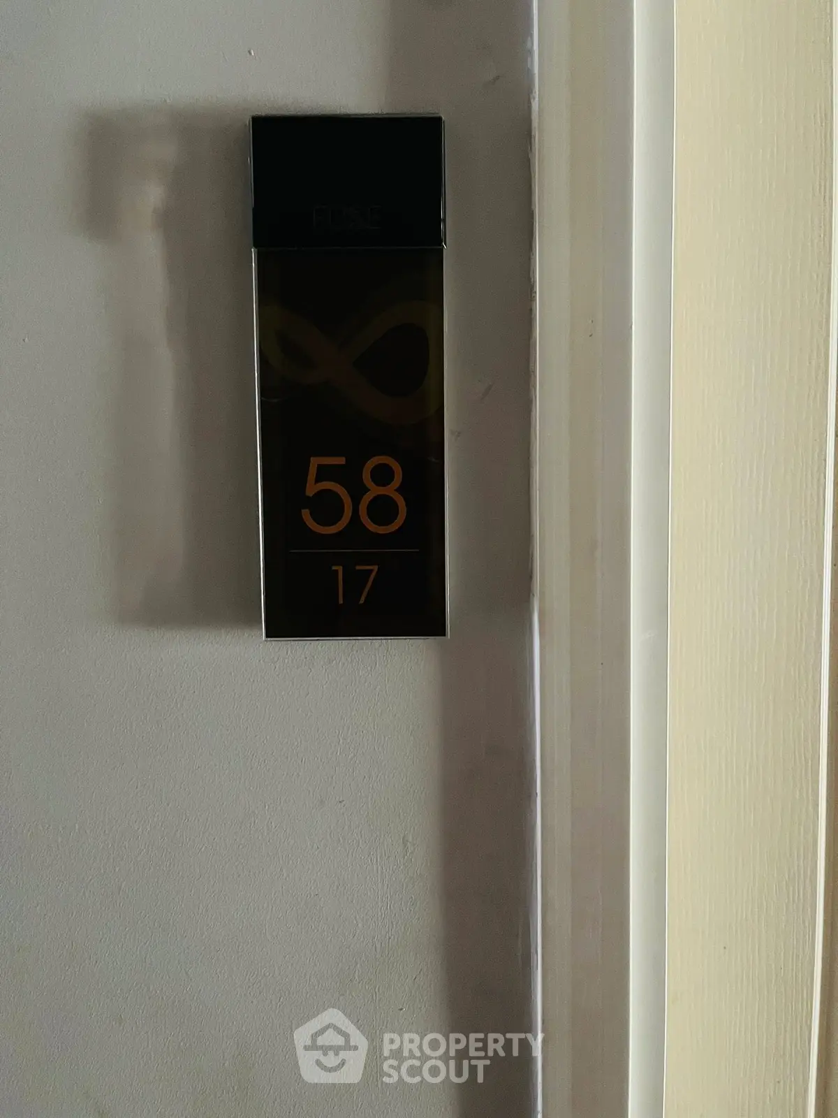 Modern apartment door with sleek room number design, showcasing contemporary style and elegance.